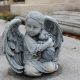 Mortuary Statue of angel and rabbit hugging